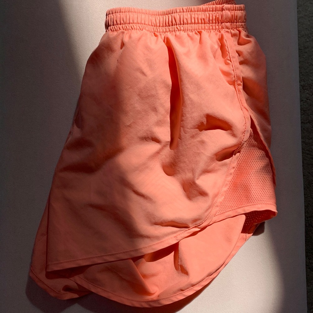 coral pink dry fit Nike running shorts